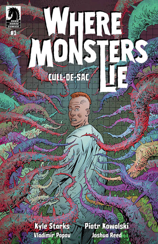Comic book cover for "Where Monsters Lie: Cull-de-Sac" featuring a terrified man surrounded by spiky, colorful tendrils.