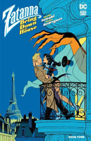 Comic book cover: Zatanna kissing a man on a Parisian balcony, ominous hand above, Eiffel Tower in background.