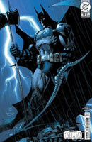 Comic book cover featuring Batman holding a hammer against a stormy background.