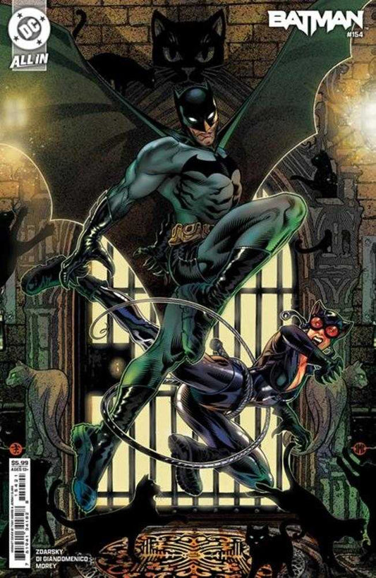 Comic book cover featuring Batman and Catwoman in action. Batman leaps forward, his cape spread wide, while Catwoman is bound by a rope. Black cats surround them in a gothic setting.