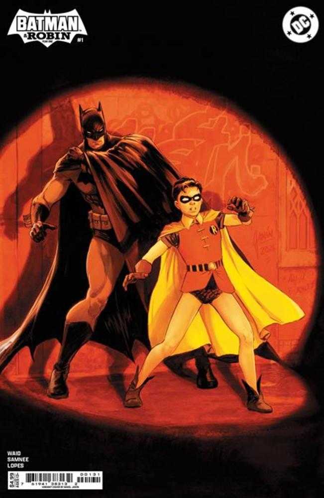 Comic book cover featuring Batman and Robin. Batman wears a dark cape and costume, while Robin is in a red and yellow outfit. Both are posed heroically against a warm-toned backdrop.