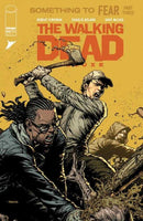A "The Walking Dead" comic book cover featuring three survivors battling zombies.