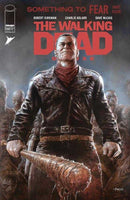 Comic book cover featuring Negan from "The Walking Dead" holding Lucille, surrounded by zombies. He is wearing a leather jacket and a red scarf.