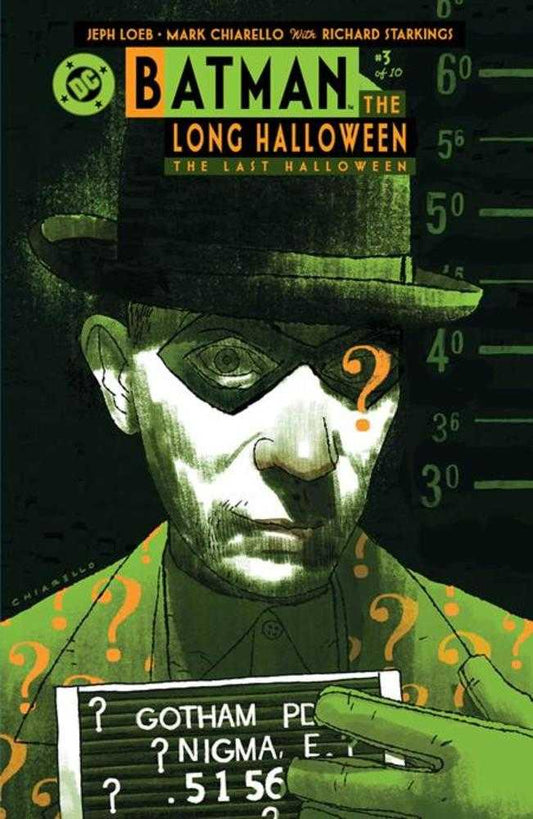 Comic book cover for Batman: The Long Halloween, featuring The Riddler in a green suit, hat, and domino mask, holding a mugshot sign with question marks.