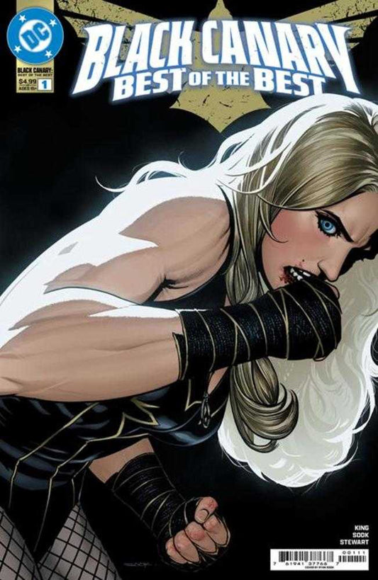 Comic book cover: Black Canary "Best of the Best" issue 1. Close-up of a blonde-haired woman biting her fist, wrapped in black bandages, wearing a black and gold costume. The DC logo is in the upper left corner.
