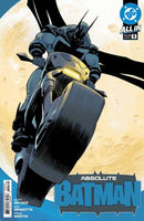 Comic book cover featuring Batman on a motorcycle against a moonlit backdrop.