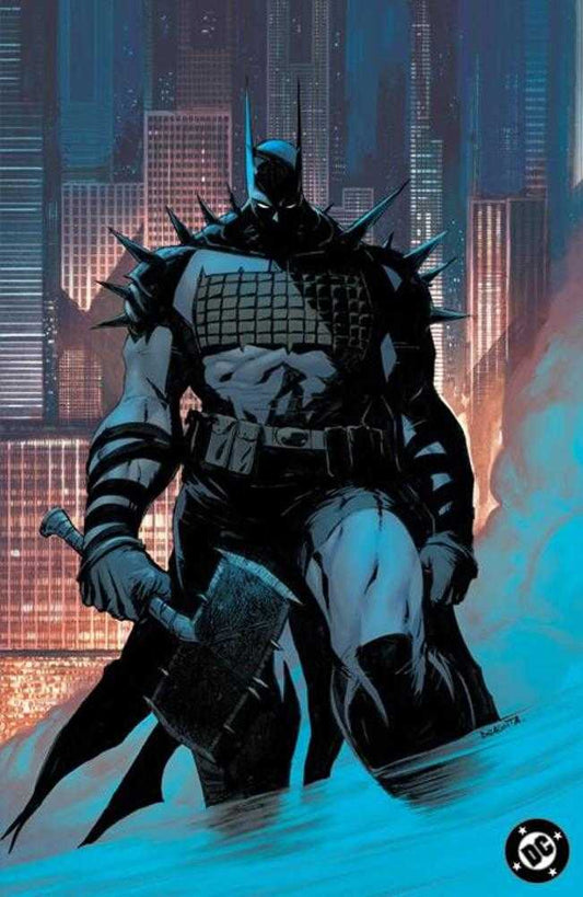Comic book image of a heavily-armored Batman with spikes on his shoulders holding a spiked hammer. He is standing in water in front of a city skyline.