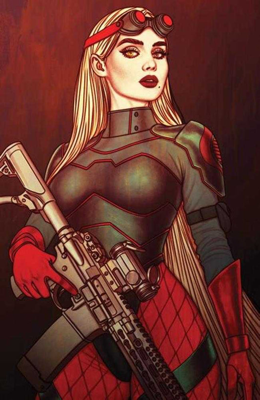 Comic book-style image of a woman with blonde hair, red headband, goggles, and red lipstick, holding a rifle, wearing a dark gray and red suit with red gloves and red diamond-patterned pants, against a dark red background.