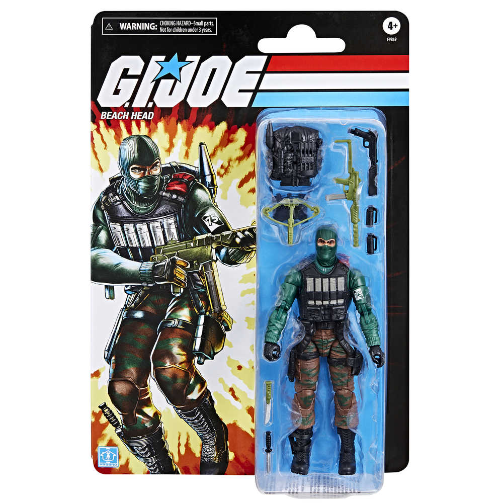Action figure, "GI JOE Beach Head," still in original packaging. The figure is dressed in a green outfit, brown camouflage pants, and black boots. He has a green mask and several weapon accessories. The packaging is black and features a graphic of the figure in a similar outfit on the left side.