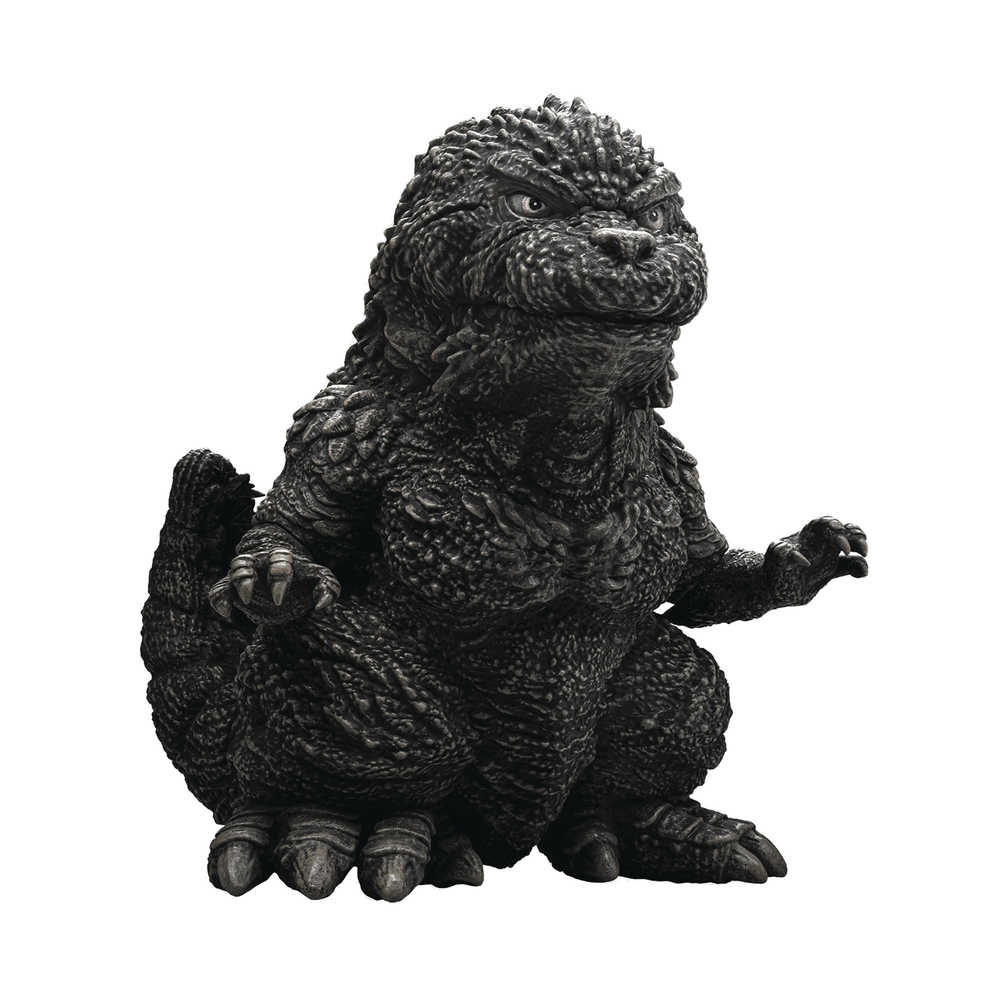 Black and white Godzilla figurine with spiky skin sitting and flexing its hands.