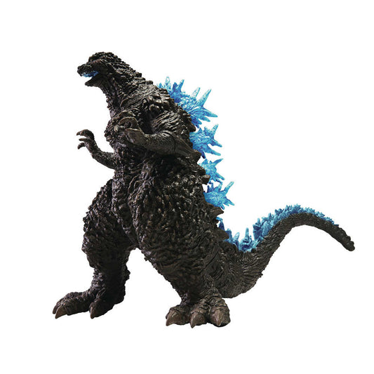 Godzilla toy figure standing with blue dorsal fins.