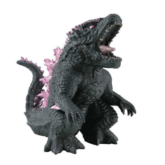 A dark gray Godzilla toy with pink dorsal fins stands in a squatting position with its mouth open.