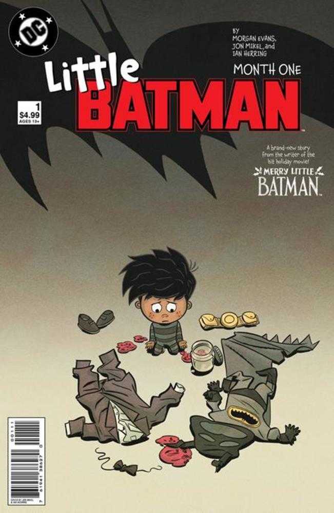 Comic book cover: Little Batman Month One. Cartoon depiction of a young boy sitting amid discarded Batman and Bruce Wayne outfits.