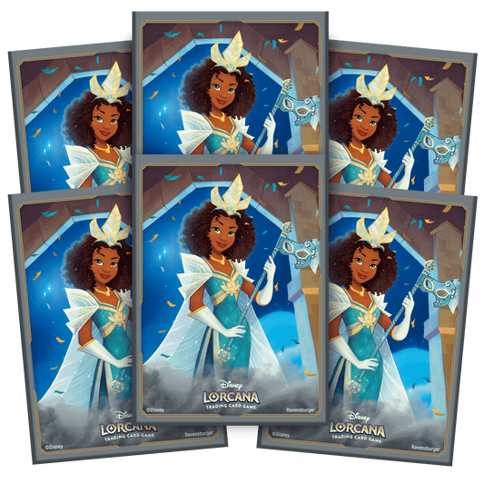 Close-up of Disney Lorcana trading cards featuring a princess with brown curly hair, blue and gold dress, and a mask.