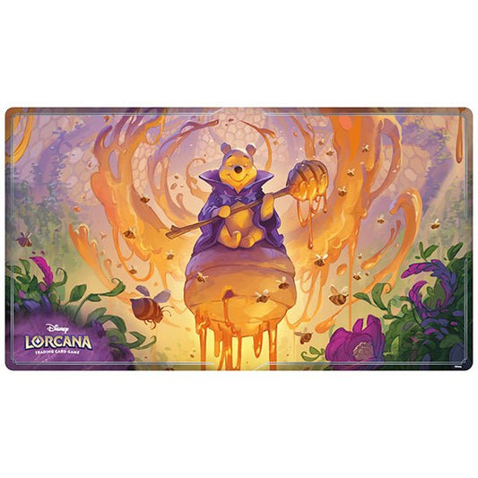 A rectangular Disney Lorcana trading card game mat featuring Winnie-the-Pooh in a purple wizard robe, sitting atop a giant beehive and holding a honey dipper, surrounded by bees and dripping honey.