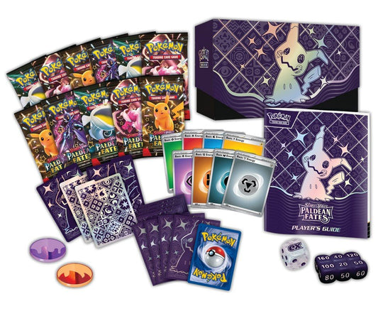 An array of Pokémon trading card game items including booster packs, energy cards, a player's guide, dice, and tokens.