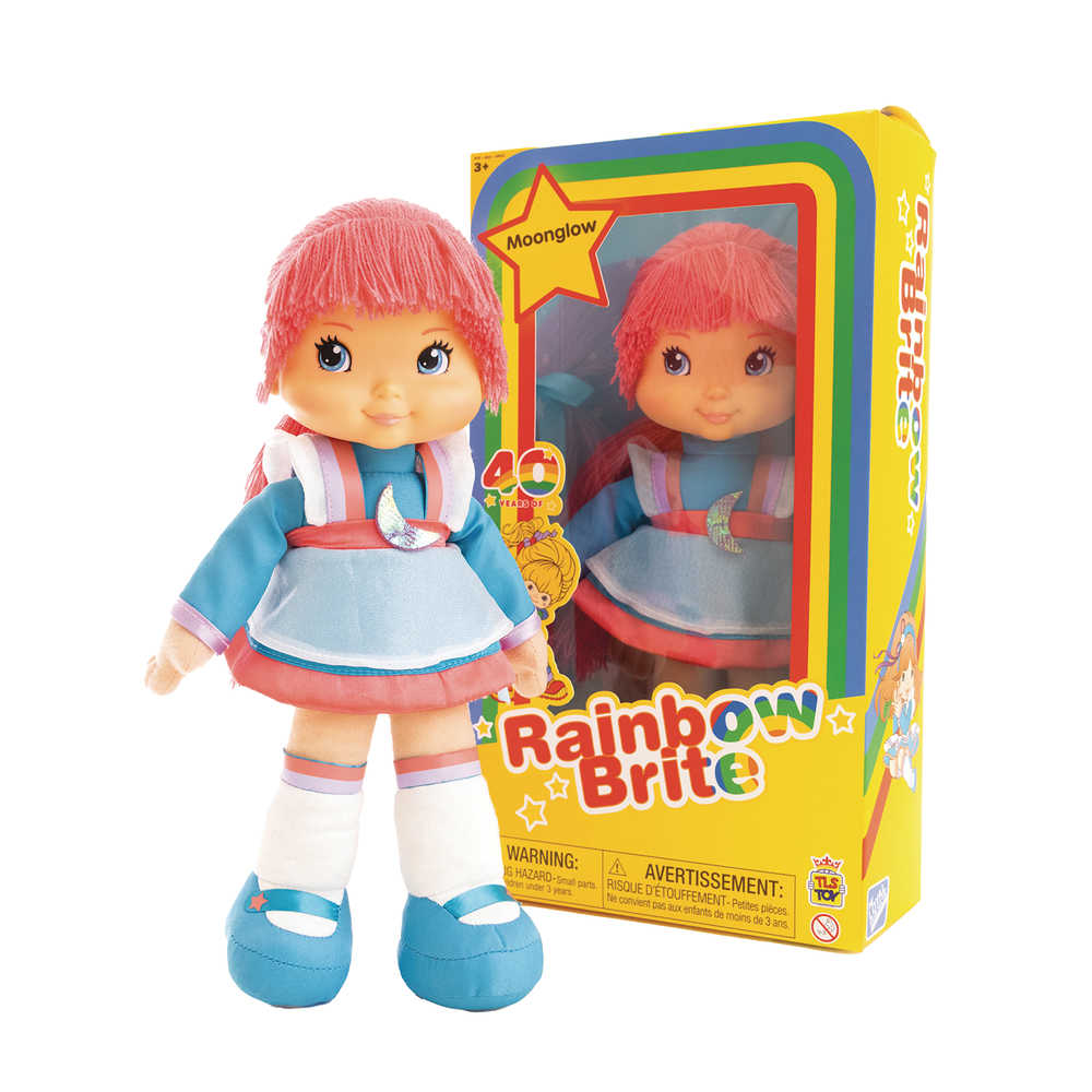 A Moon Glow Rainbow Brite doll stands next to its yellow box with rainbow trim.