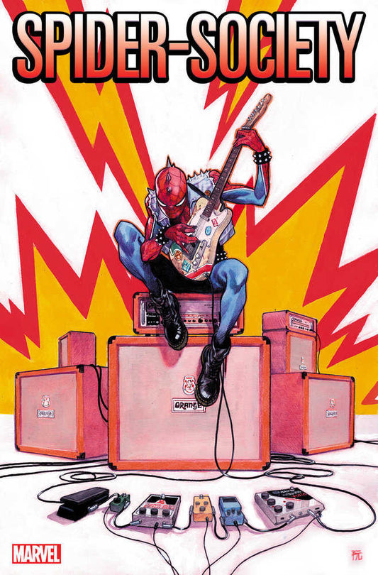Comic book cover featuring Spider-Punk playing guitar, sitting on orange amplifiers with red and yellow lightning background.