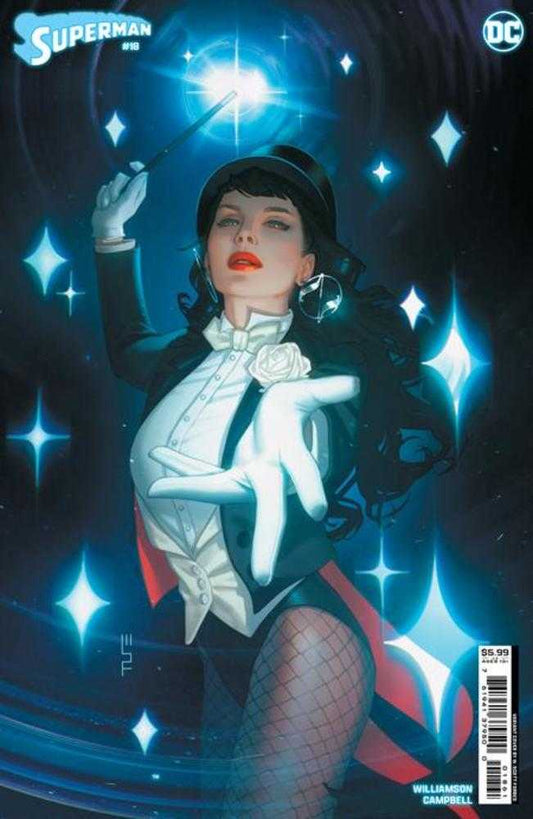 Comic book cover featuring Zatanna in a magician's tuxedo, fishnet stockings, top hat, and holding a wand, surrounded by sparkling stars.