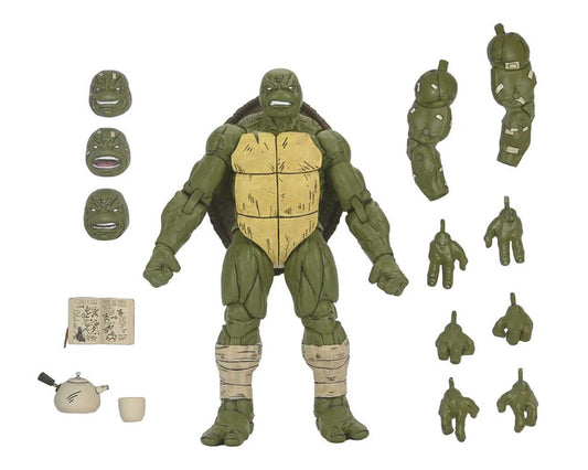 Product shot of a Teenage Mutant Ninja Turtles action figure and accessories, including interchangeable faces, hands, arms, a tea set, and a book, all against a white background.
