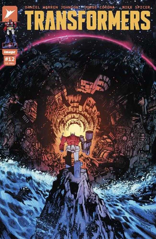 Comic book cover titled "Transformers" with a red and blue robot standing on a mountain in front of a mechanical backdrop.