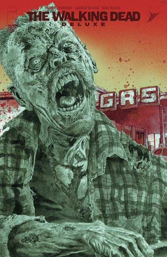 Comic book cover of "The Walking Dead Deluxe," featuring a zombie in a plaid shirt in front of a gas station.
