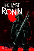 Here is a descriptive alt tag for the image:

Comic book cover for "Teenage Mutant Ninja Turtles: The Last Ronin" shows a ninja turtle in all black clothing with a dark green face mask, standing in front of a large red circle. The turtle carries weapons across their back.
